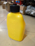 Yellow container with black lid on a tiled floor in an indoor setting
