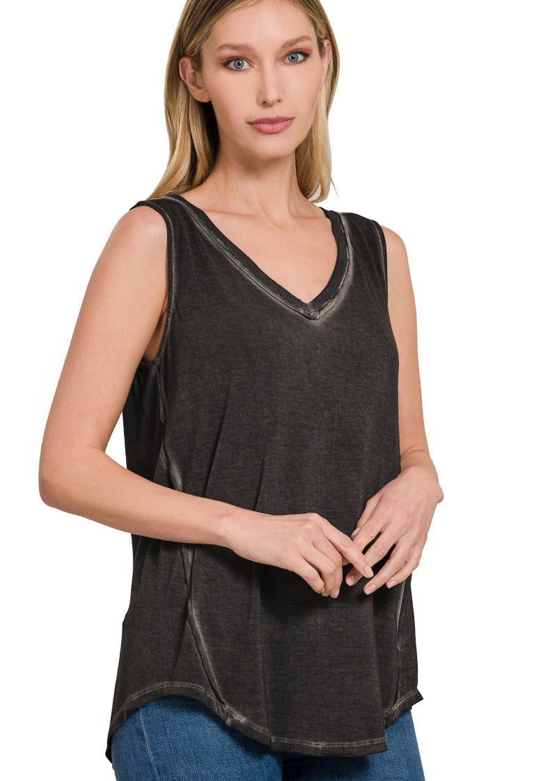 Woman wearing Zenana sleeveless V-neck top with hi-low hem for a casual summer look