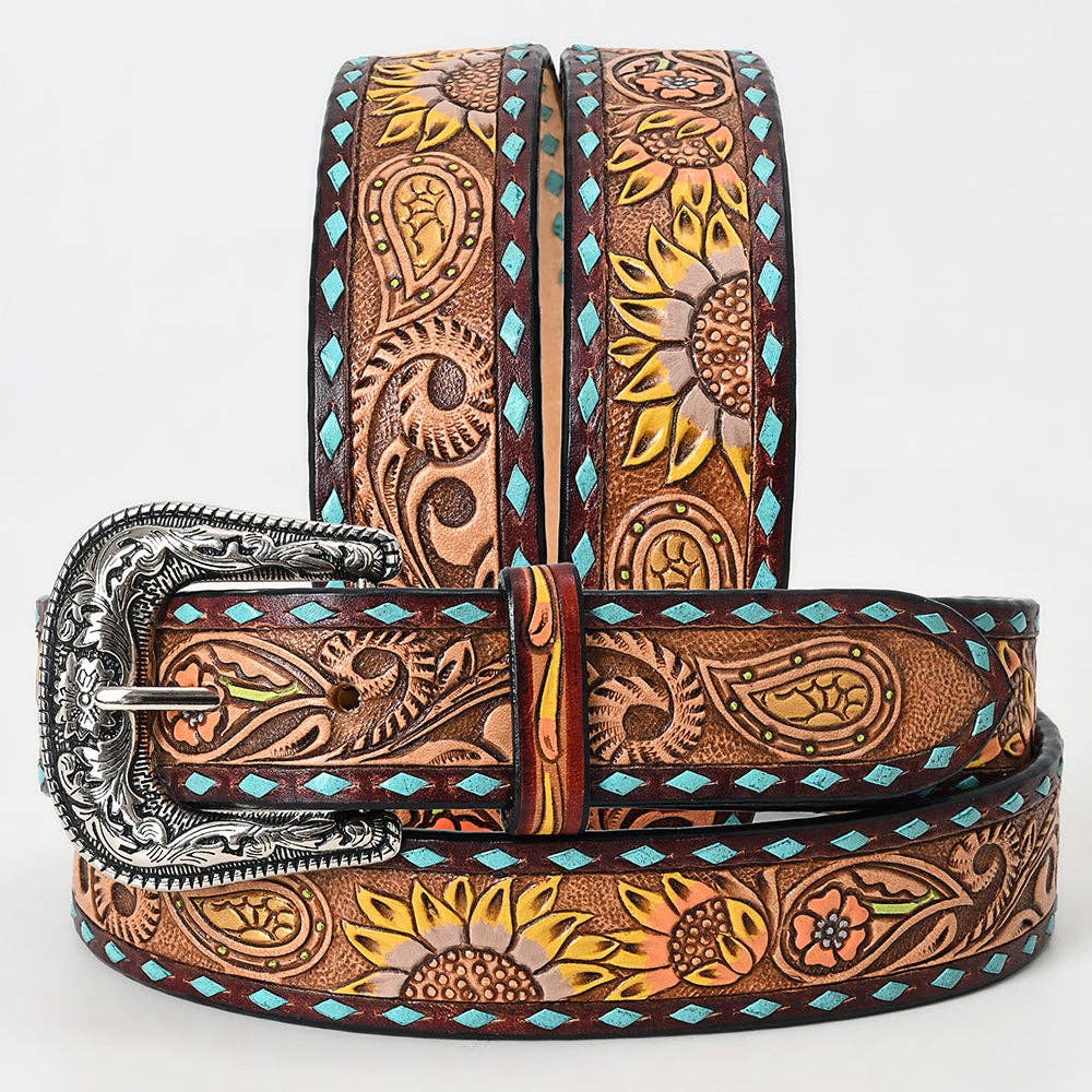 Decorative leather belt with intricate patterns and a silver buckle on a white background