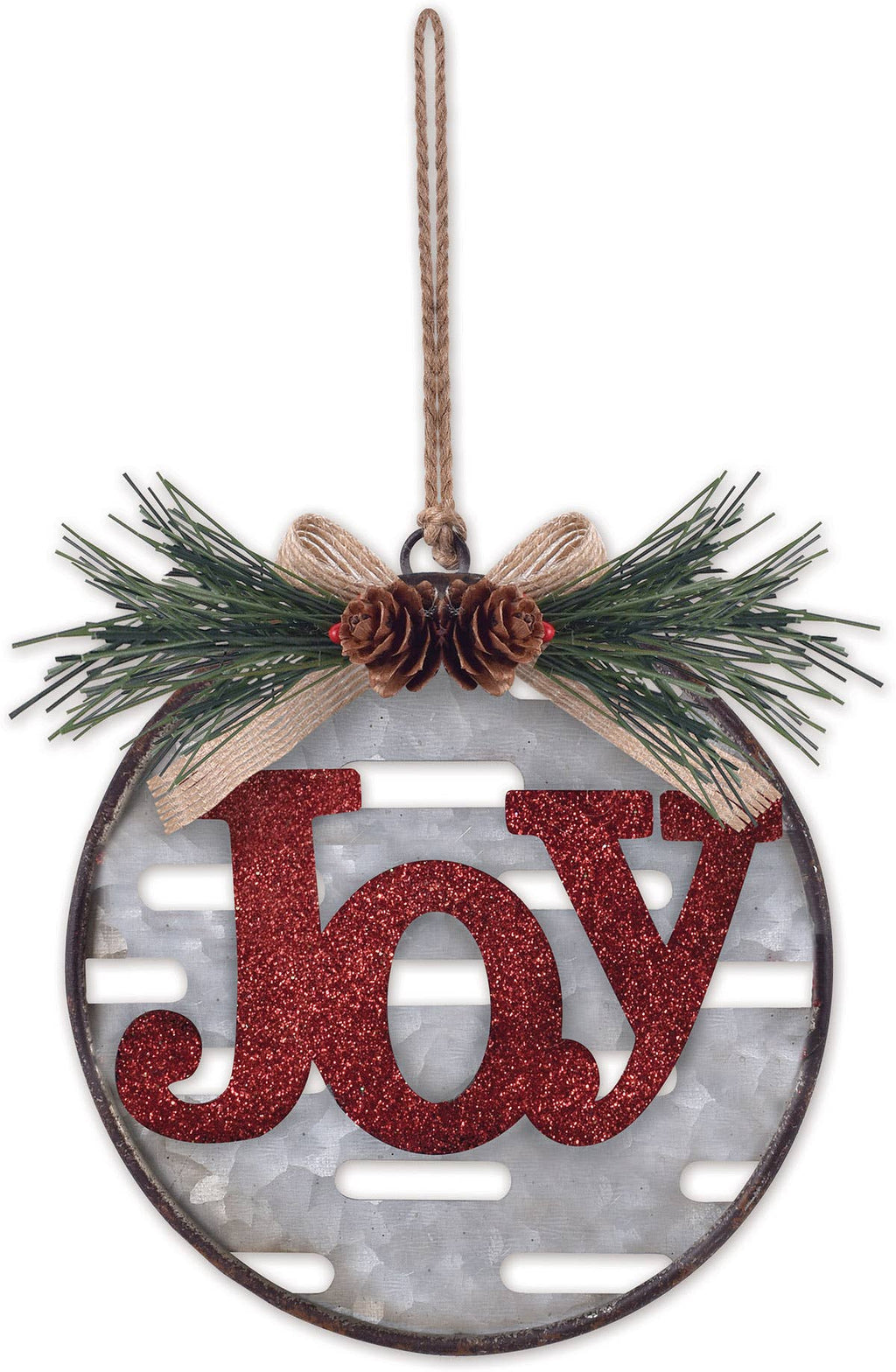 A round Christmas ornament featuring the word "Joy" in glittery red script over a white textured background with horizontal cutout slots. The ornament is decorated with green pine branches, a burlap bow, and two small pinecones, hanging from a natural twine string.