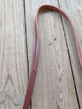 A up-close of a brown amish made leather split ear headstall.
