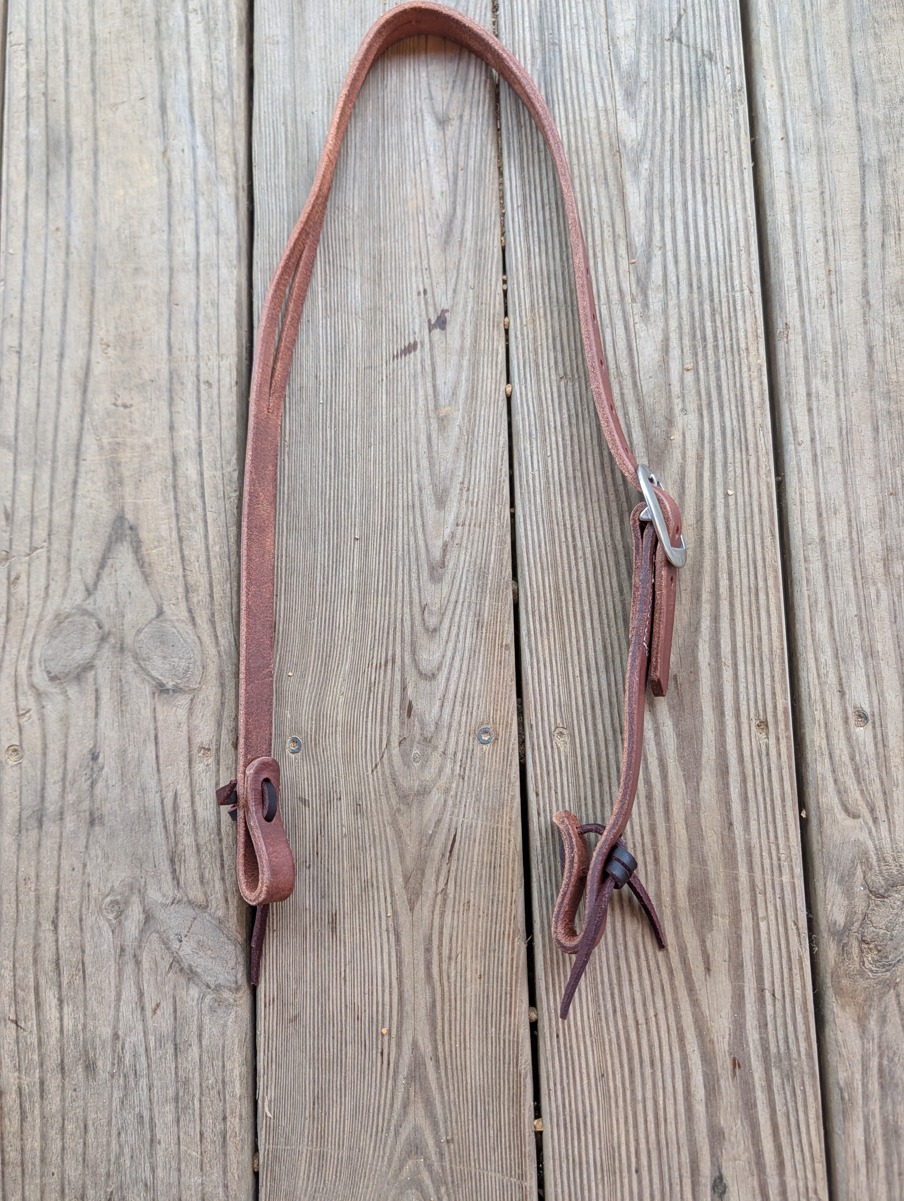 A handcrafted Amish made split ear leather headstall with silver buckle. 