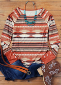 Aztec print long sleeve top with button cuff detail in warm desert tones
