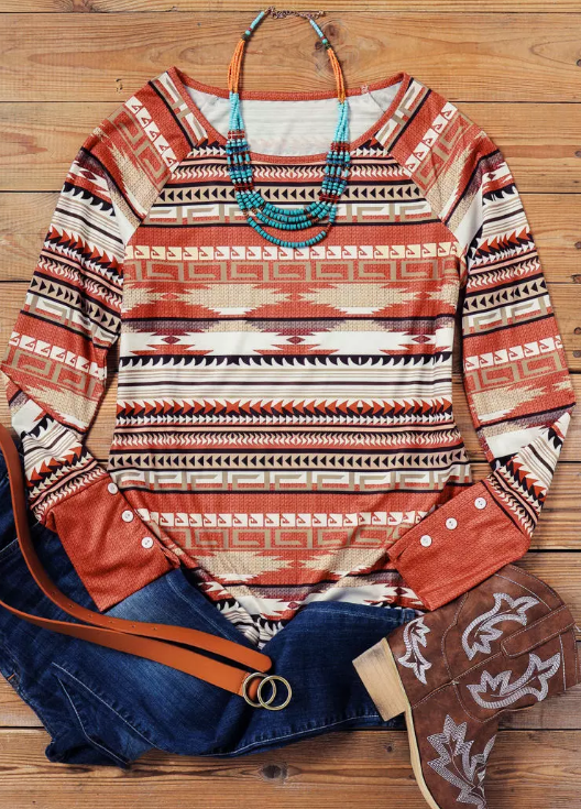 Aztec print long sleeve top with button cuff detail in warm desert tones