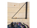 A black folding clothes bar with multiple hanging racks, shown partially folded and mounted on a wooden wall, displaying various colorful garments.