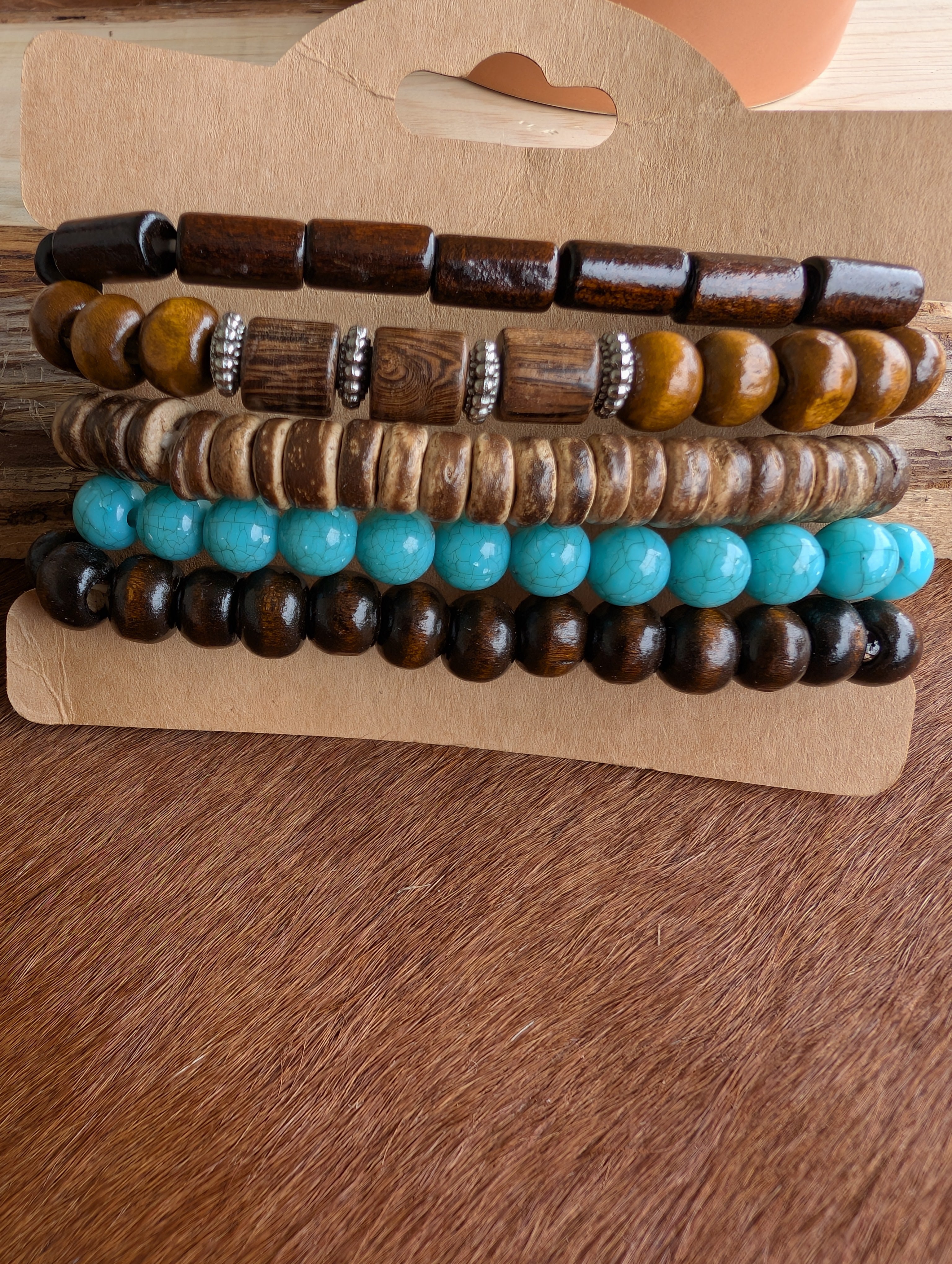 Neutral boho bracelet set laid flat with natural textures and colors