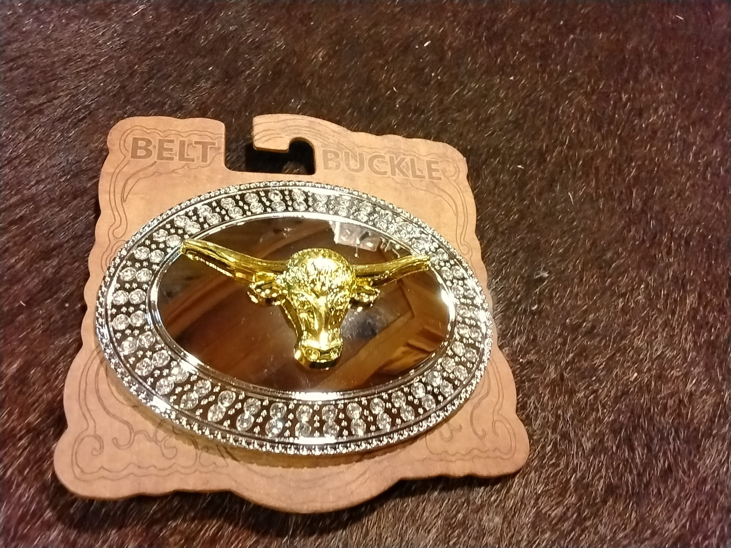 gold belt buckle with bull head and clear stones