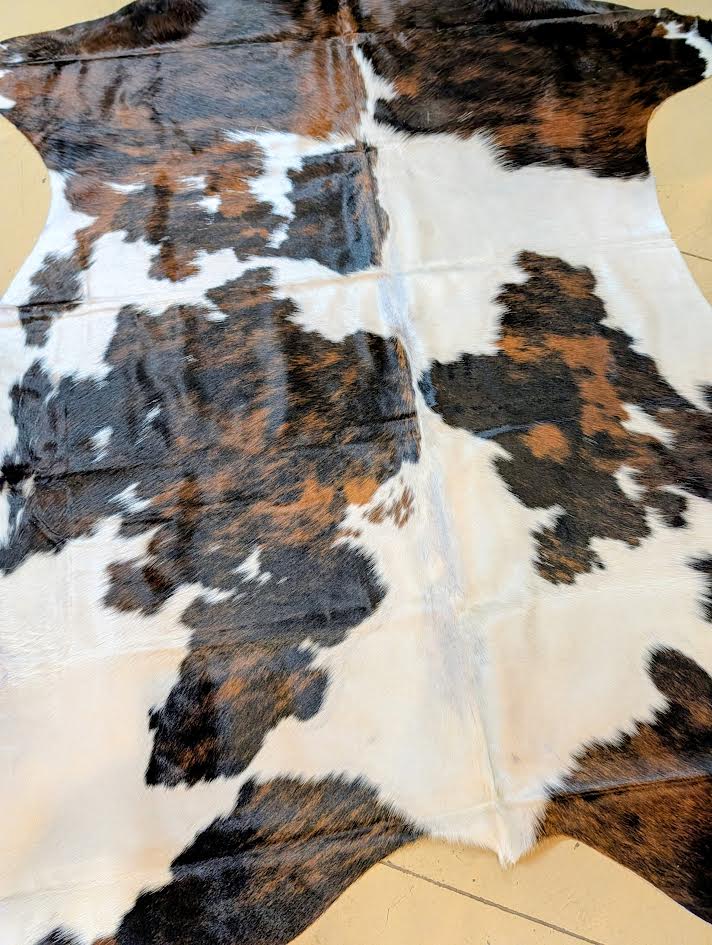 Cowhide named Stinger close up view of the color and grain patterns