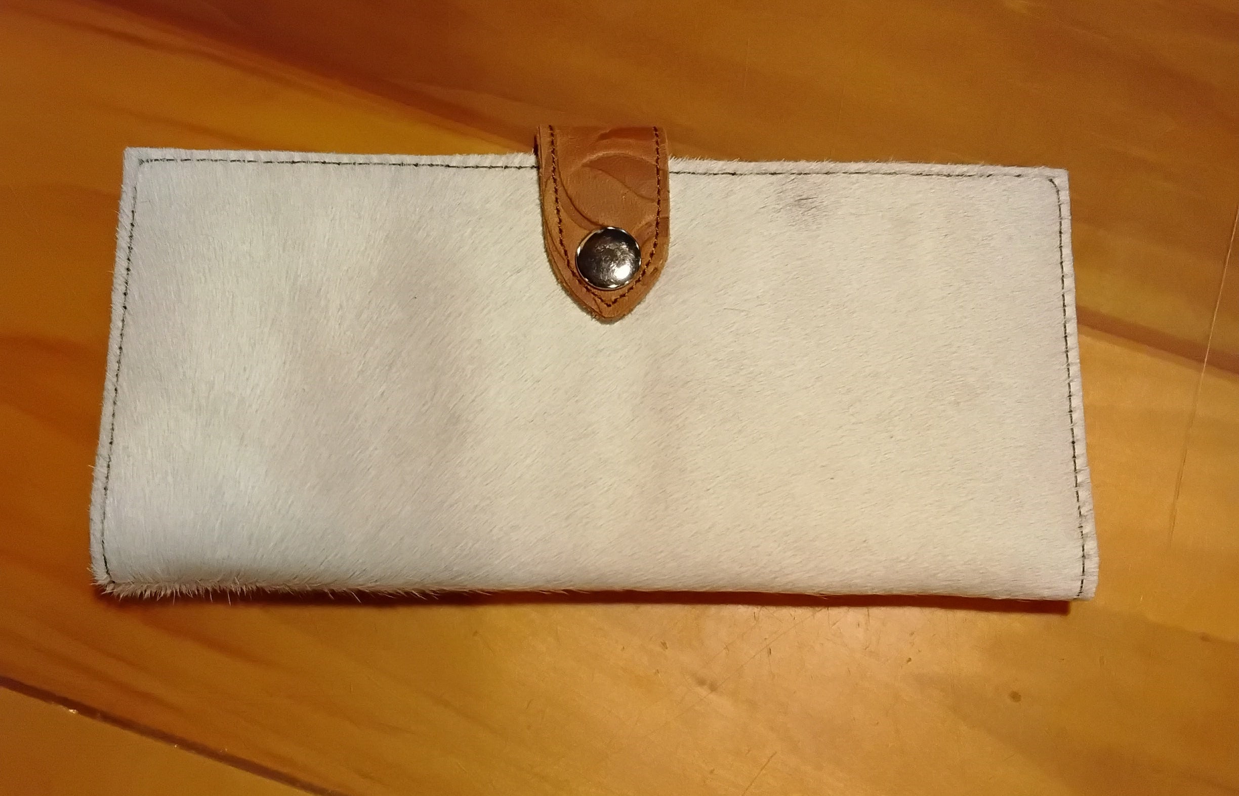 white cowhide checkbook wallet