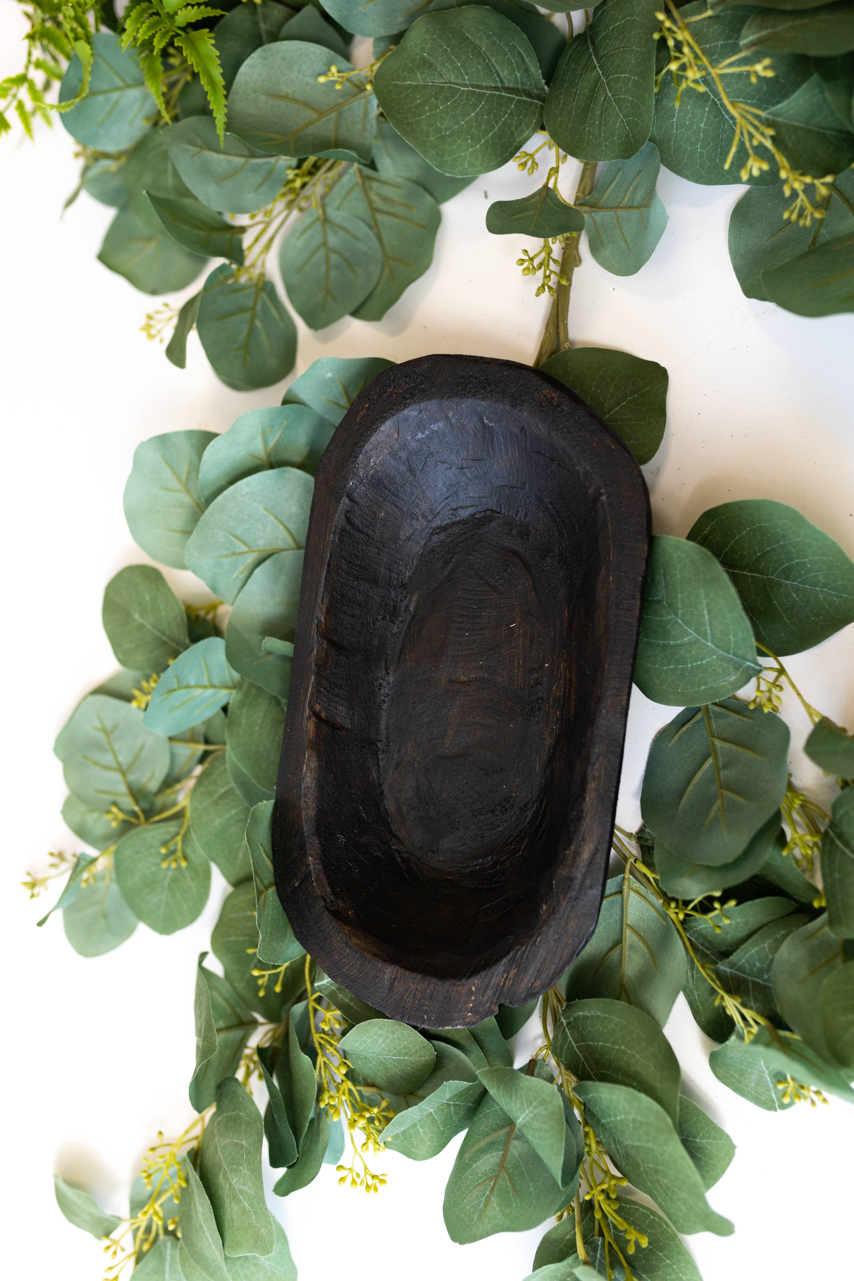 Decorative raw wood bowl featuring natural imperfections