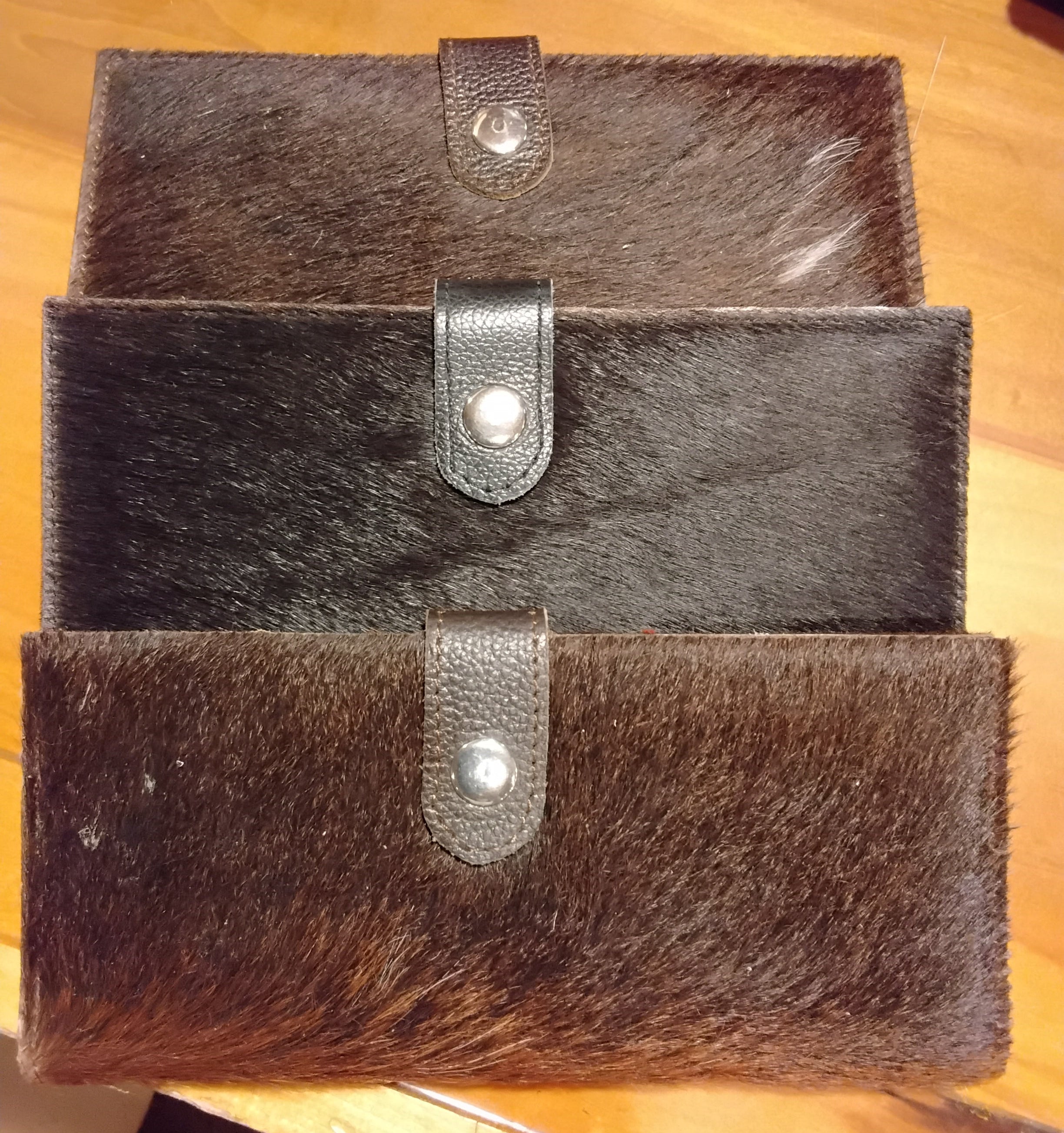 dark colored cowhide checkbook wallets