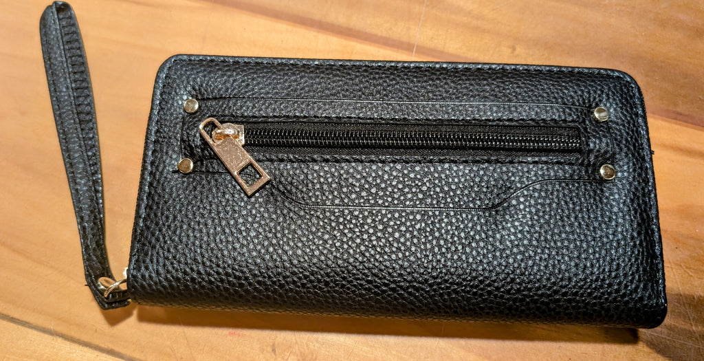 Compact hands-free wristlet wallet made of durable faux leather in black