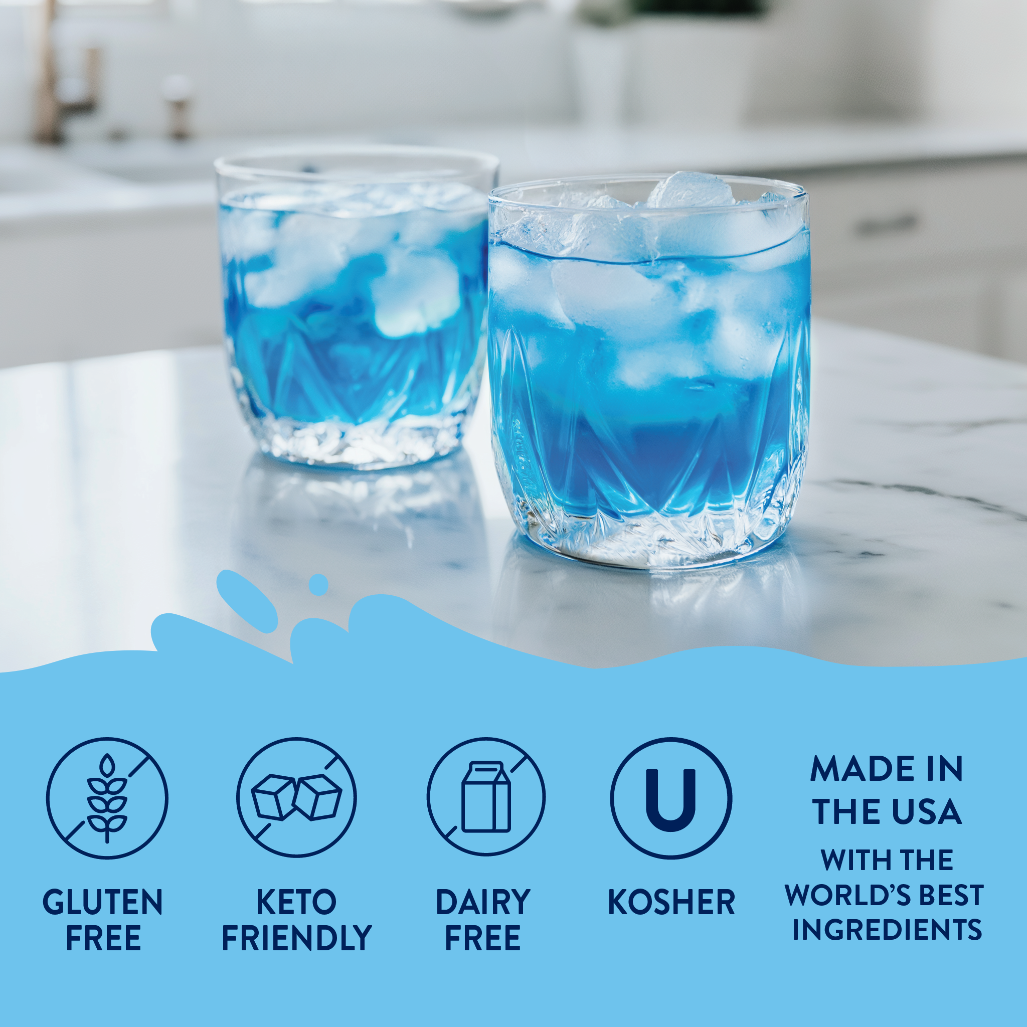 Two glasses of blue liquid with ice on a marble countertop, featuring dietary label icons and text.