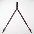 Brown hand-tooled genuine bridle leather Y-back suspenders with basket stamp pattern and metal scissor snaps.