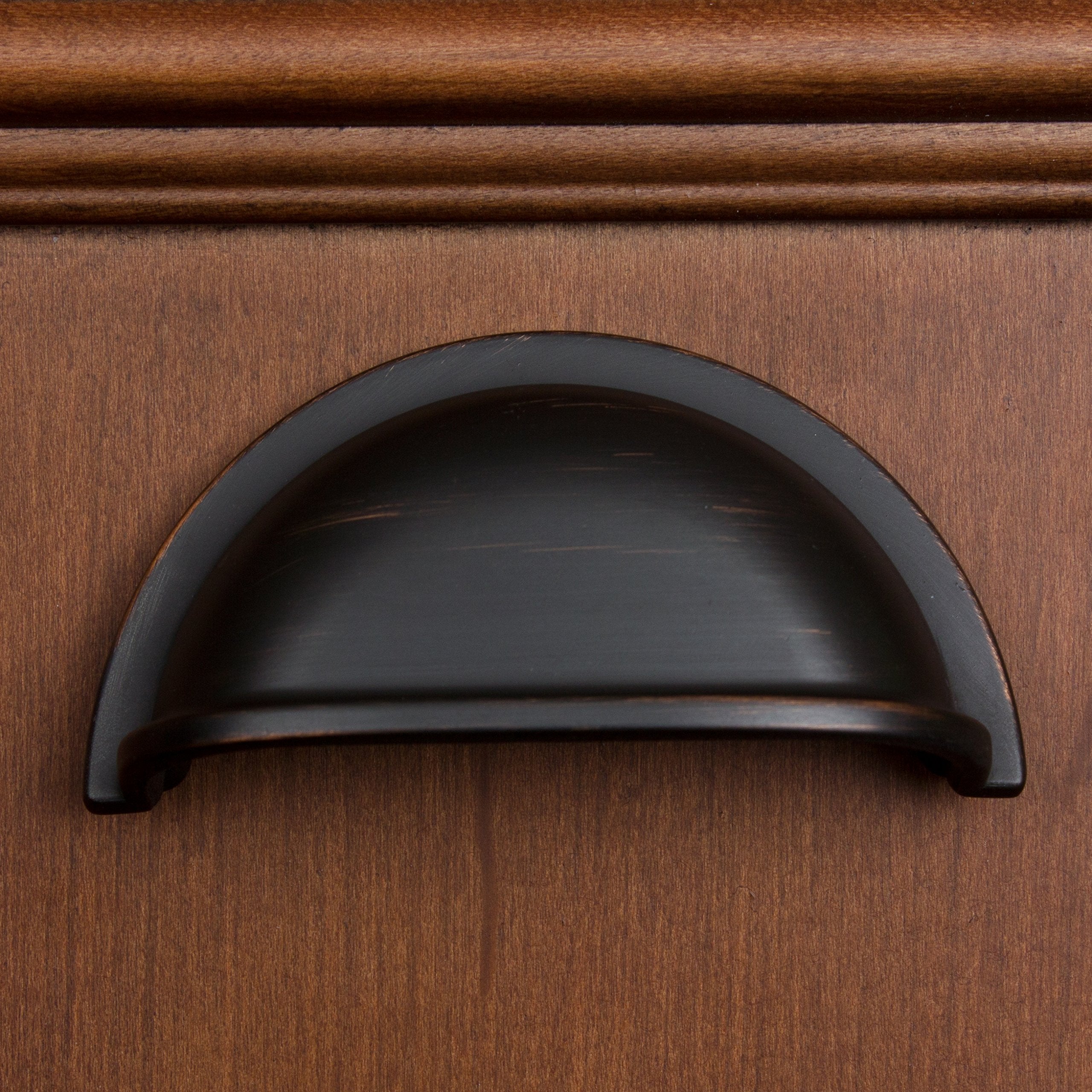 bronze gliderite drawer pull on a drawer