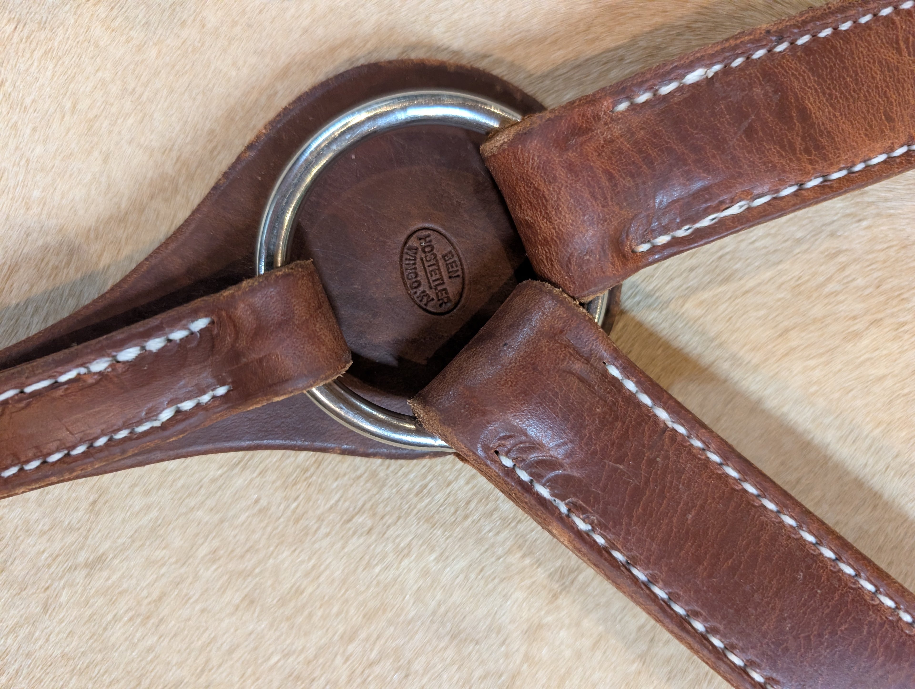 Up-close of Handcrafted Herman Oak Leather Montreal breast collar with Ben Hostetler maker stamp 