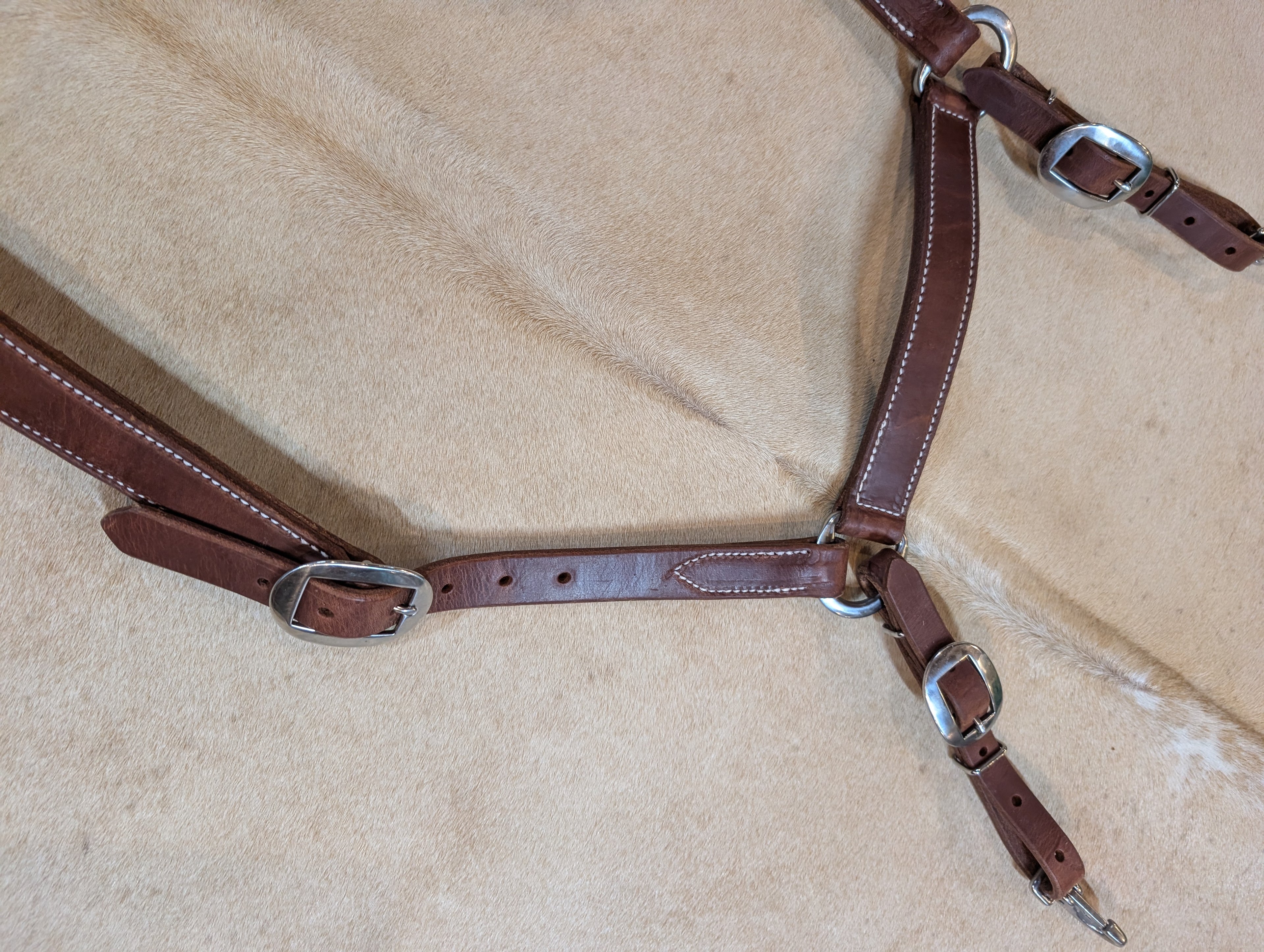 Ben Hostetler handcrafted Herman Oak leather Montreal breast collar for horses with adjustable tug straps.
