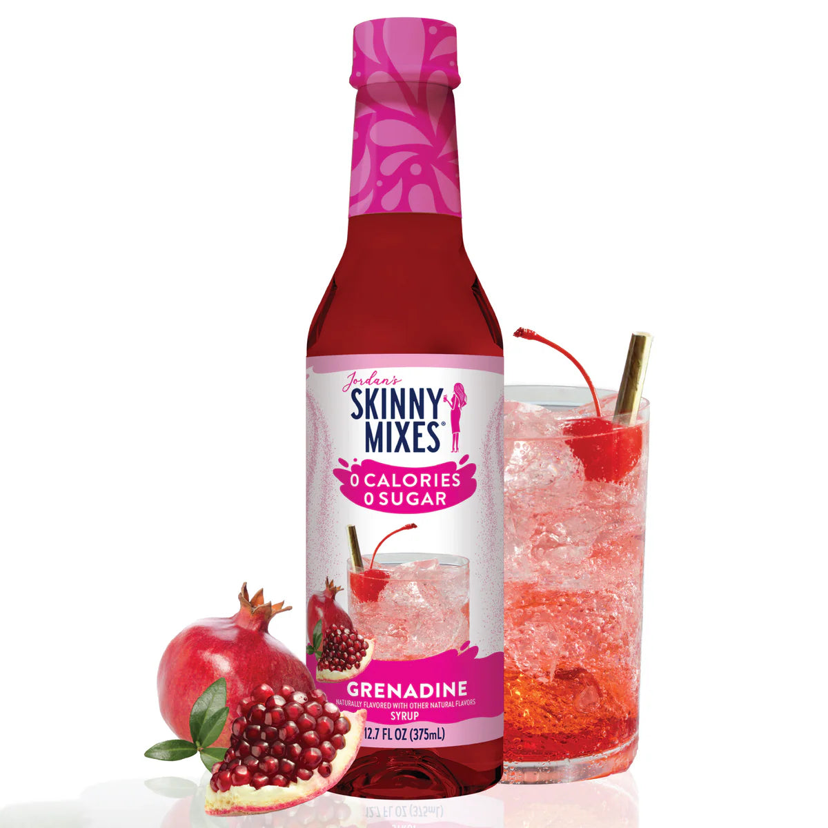 Jordon's Skinny Mix Grenadine flavored drink in a glass and pomegranate next to bottle.