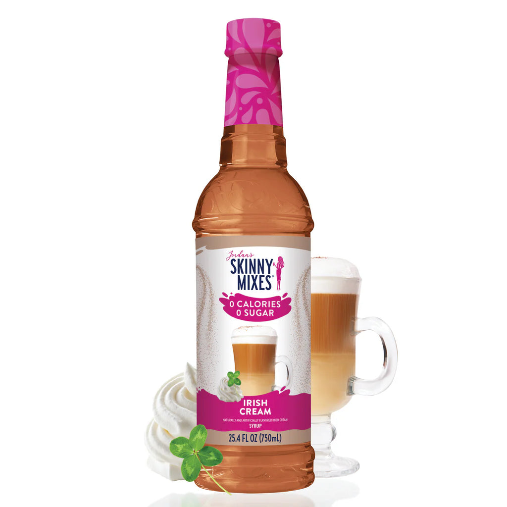 Jordan's Skinny Mixes Irish Cream syrup bottle with a glass of coffee and topped with foam