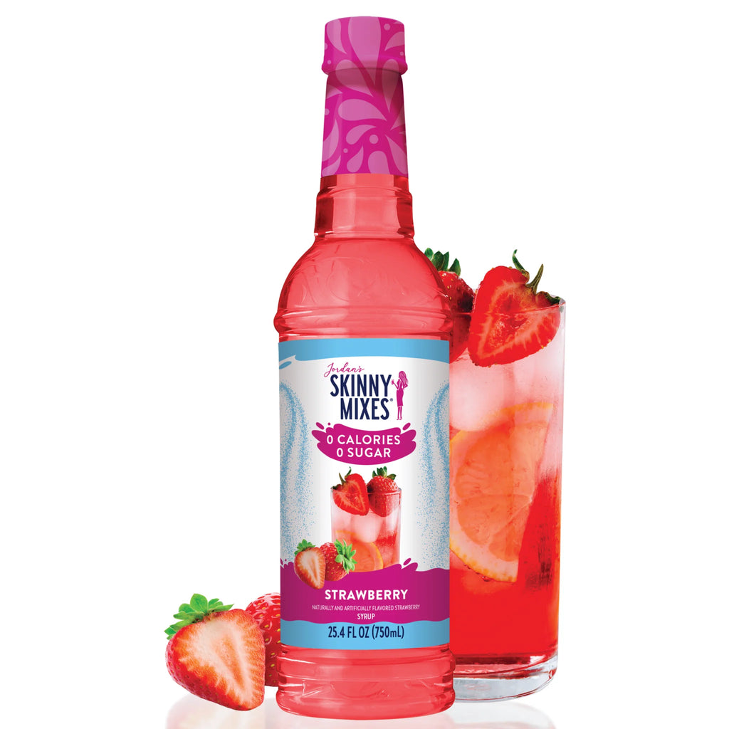Jordan's Skinny Mixes strawberry syrup bottle with a glass of strawberry syrup cocktail and strawberries 