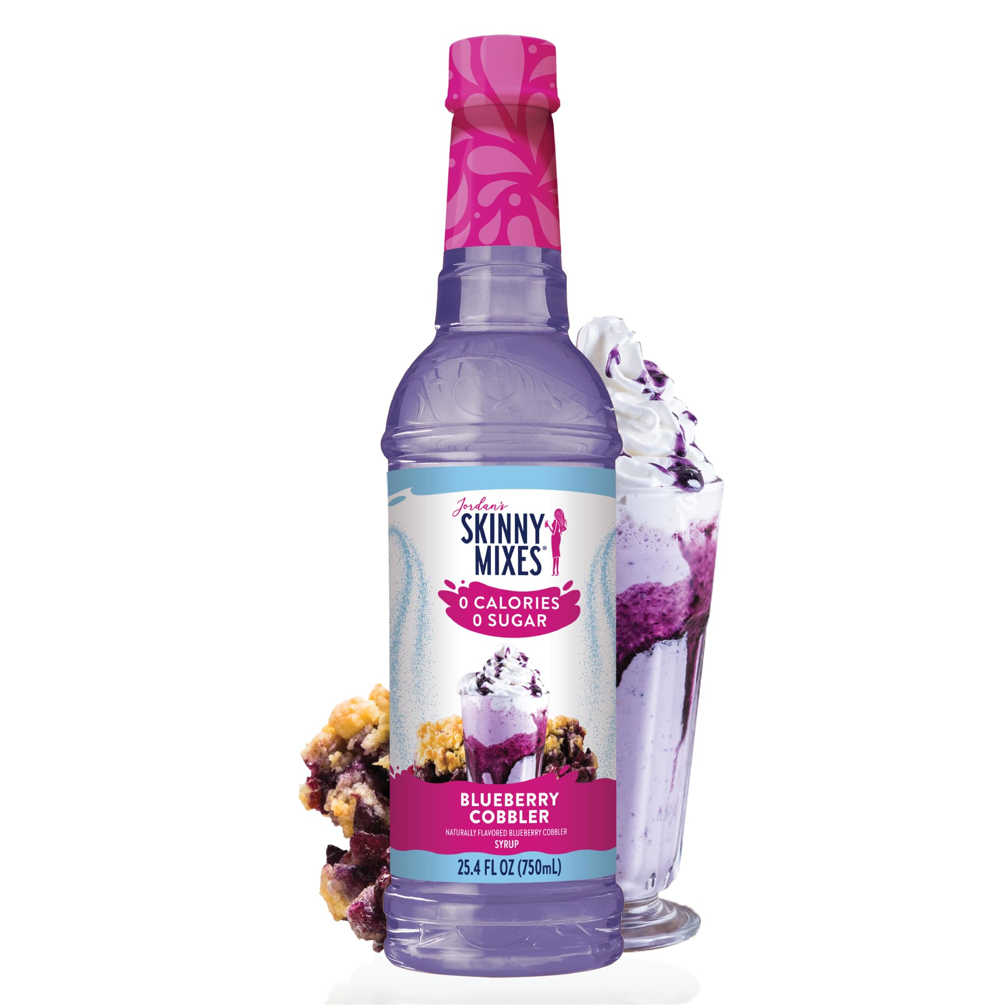  A bottle of Jordan's Skinny Mix in the flavor Blueberry Cobbler next to a shake topped with  whipped cream and a slice of blueberry cobbler