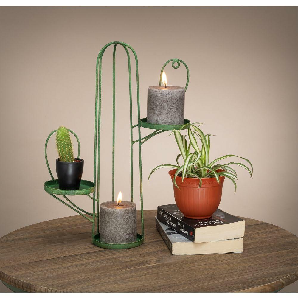 Tough 1 metal cactus candle stand on wooden mantel with candle