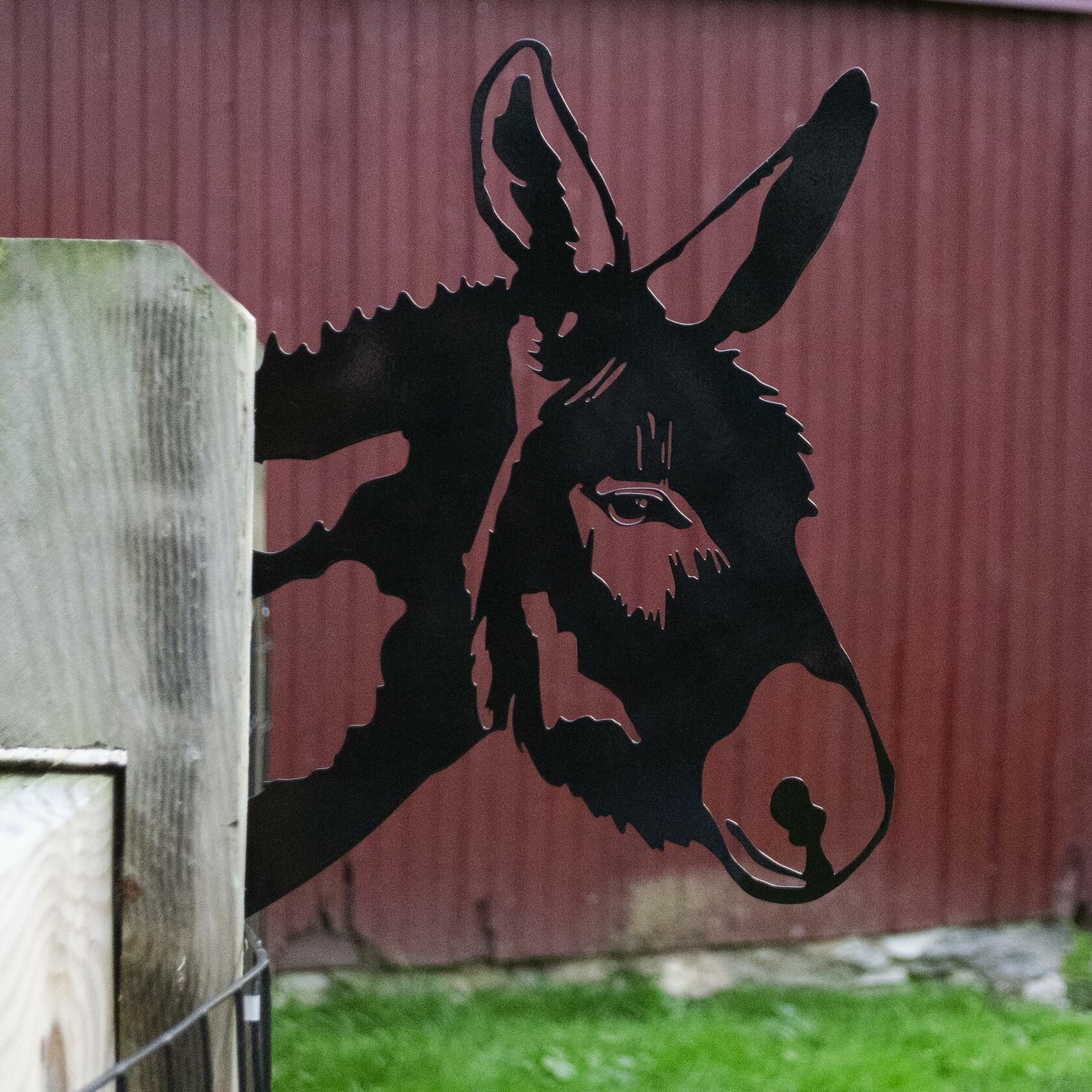 Whimsical metal donkey silhouette in rustic finish, perfect for garden, porch, or barn decoration.