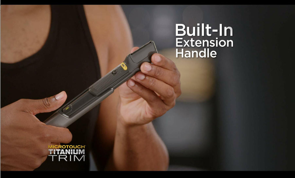Person holding a tool with 'Built-In Extension Handle' text and 'MicroTouch Titanium Trim' branding.