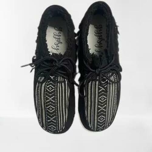 Pair of black and white patterned shoes on a white background