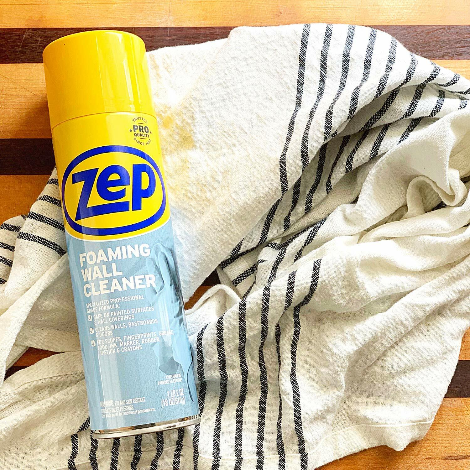 Zep foaming wall cleaner can on a striped towel with a wooden surface