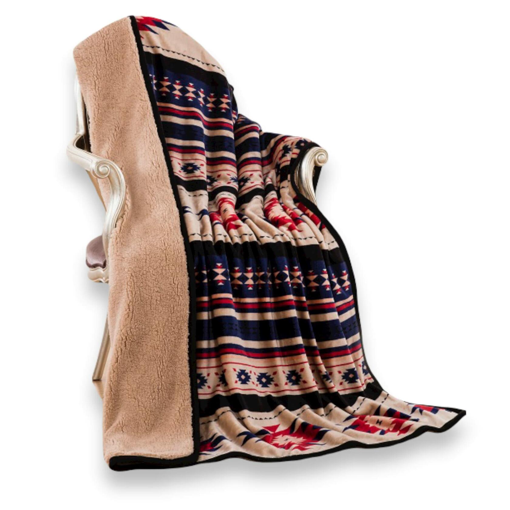 Patterned blanket draped over a chair on a white background