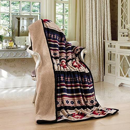 Patterned blanket draped over a chair in a room with curtains and furniture.