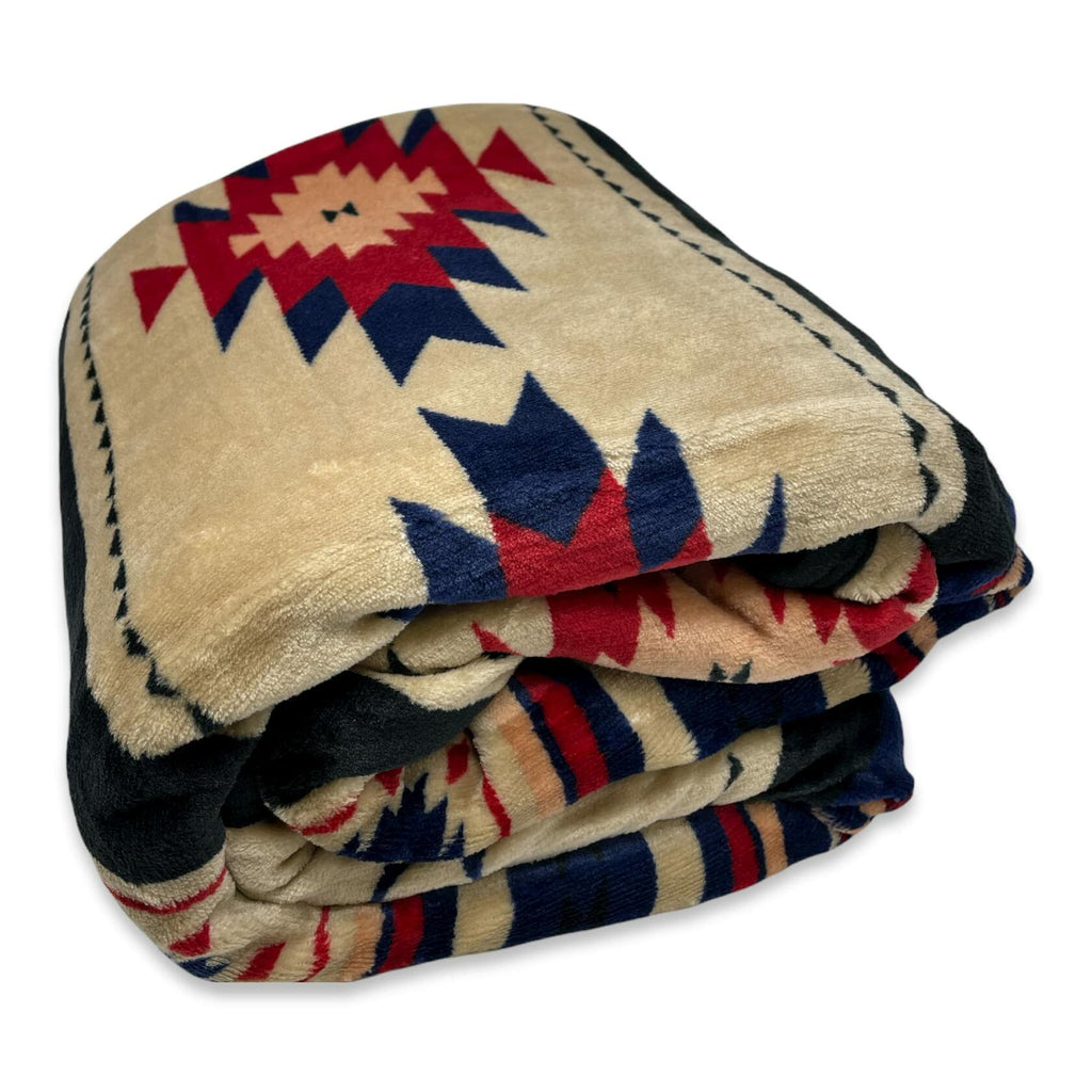 Folded blanket with geometric pattern on a white background