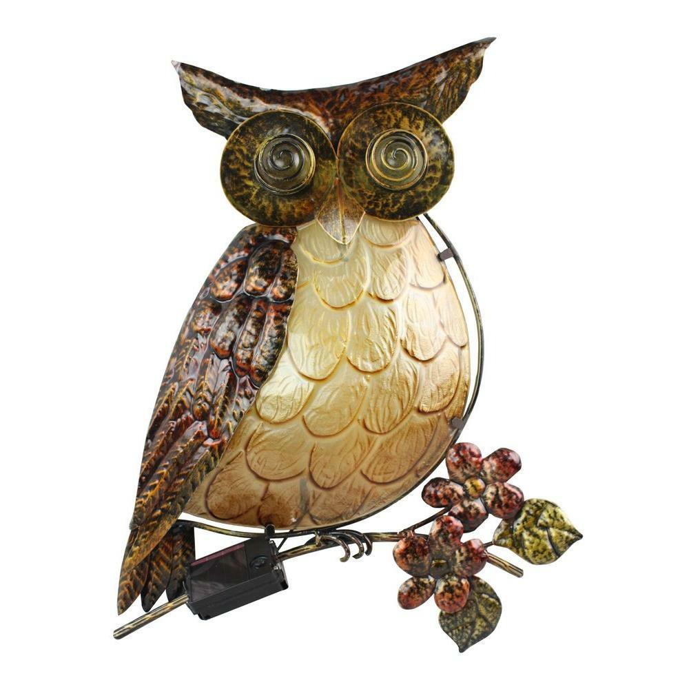 Decorative owl with a solar panel on a white background