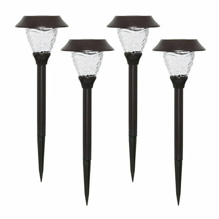 Four solar garden lights with glass shades on a white background