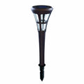 Solar-powered garden light with brown base and clear glass cover on a white background
