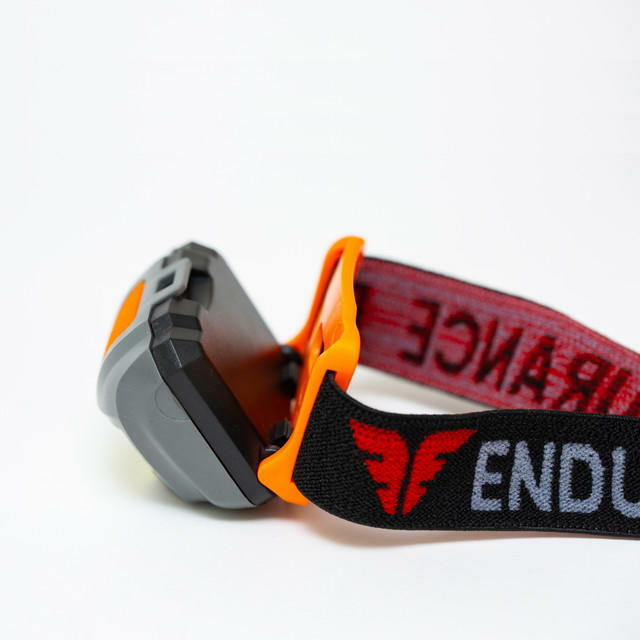 Dog collar with orange clip and visible branding on a white background