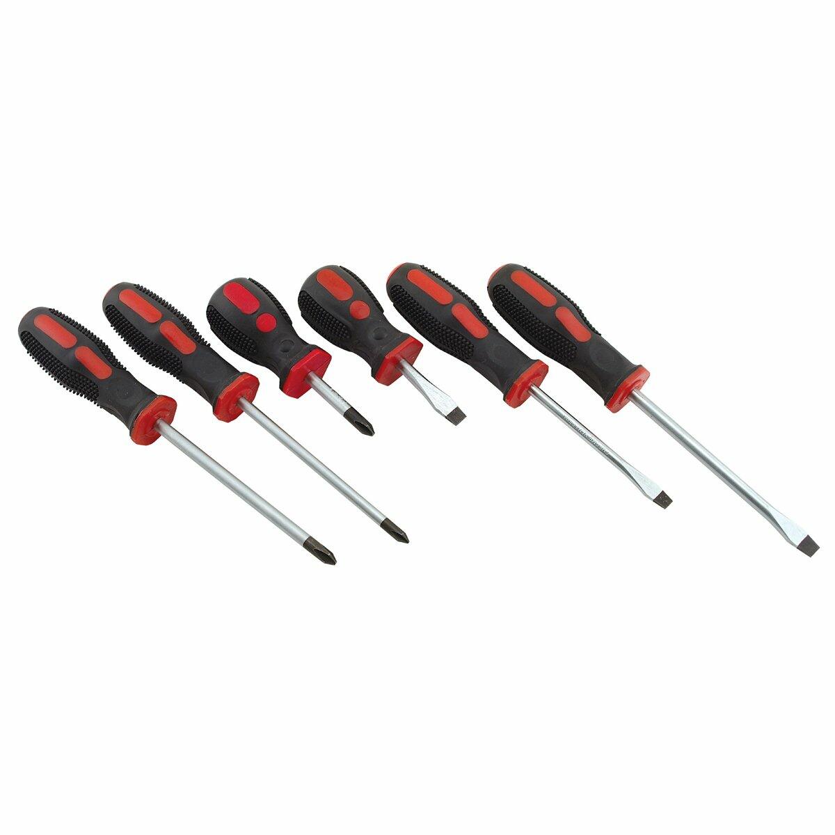 Set of six screwdrivers with red handles on a white background