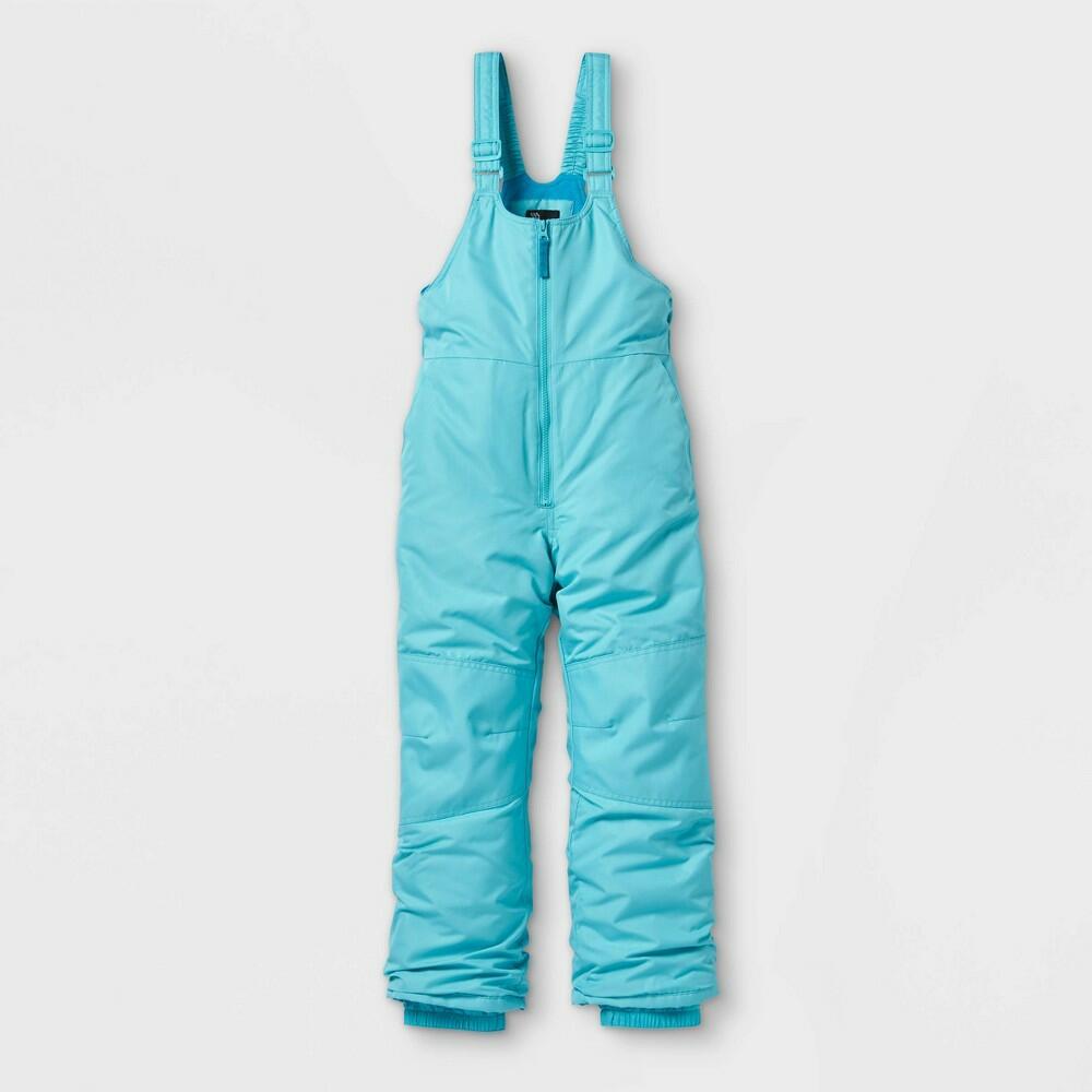 Turquoise snow bib overalls on a light gray background