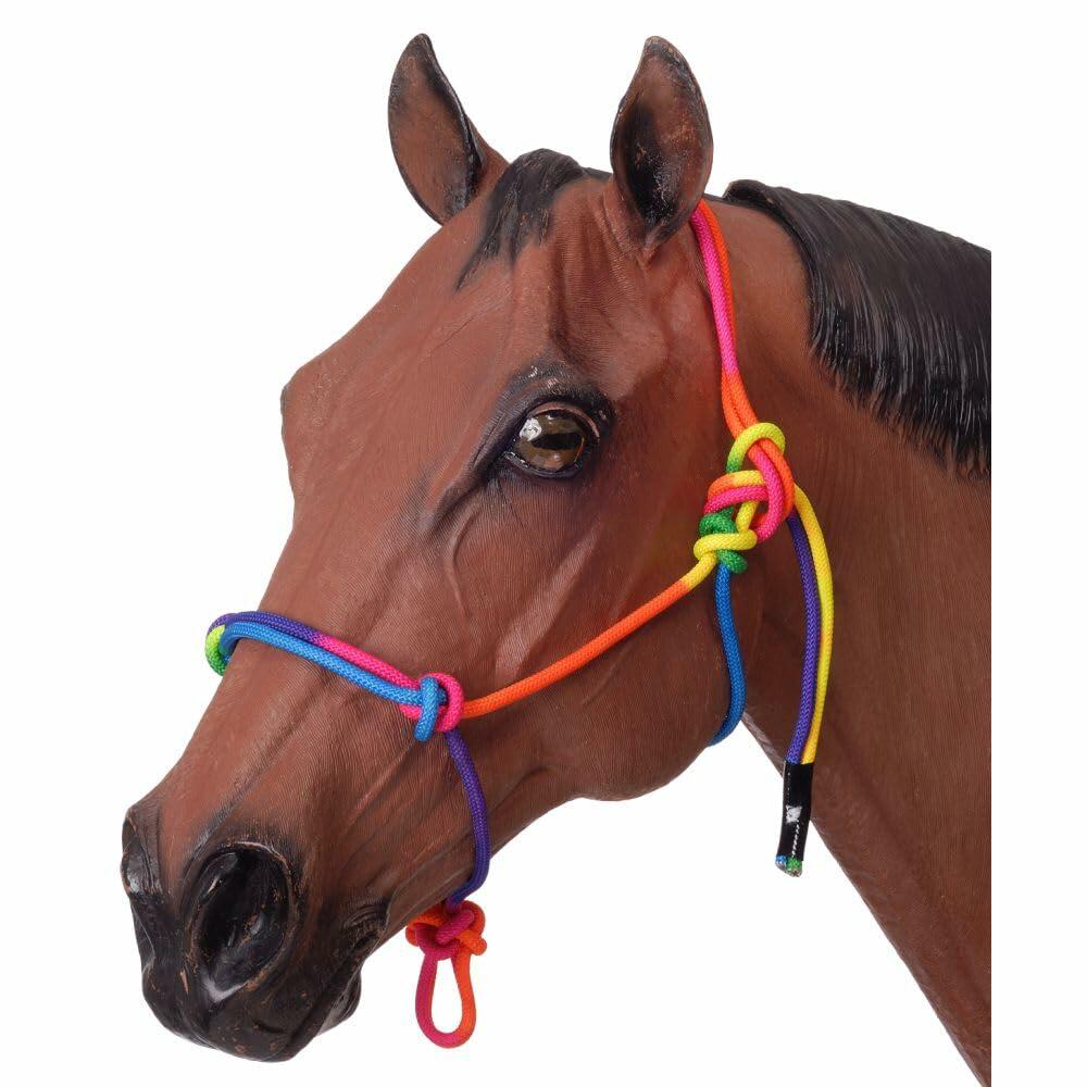 Model horse head with colorful bridle on a white background