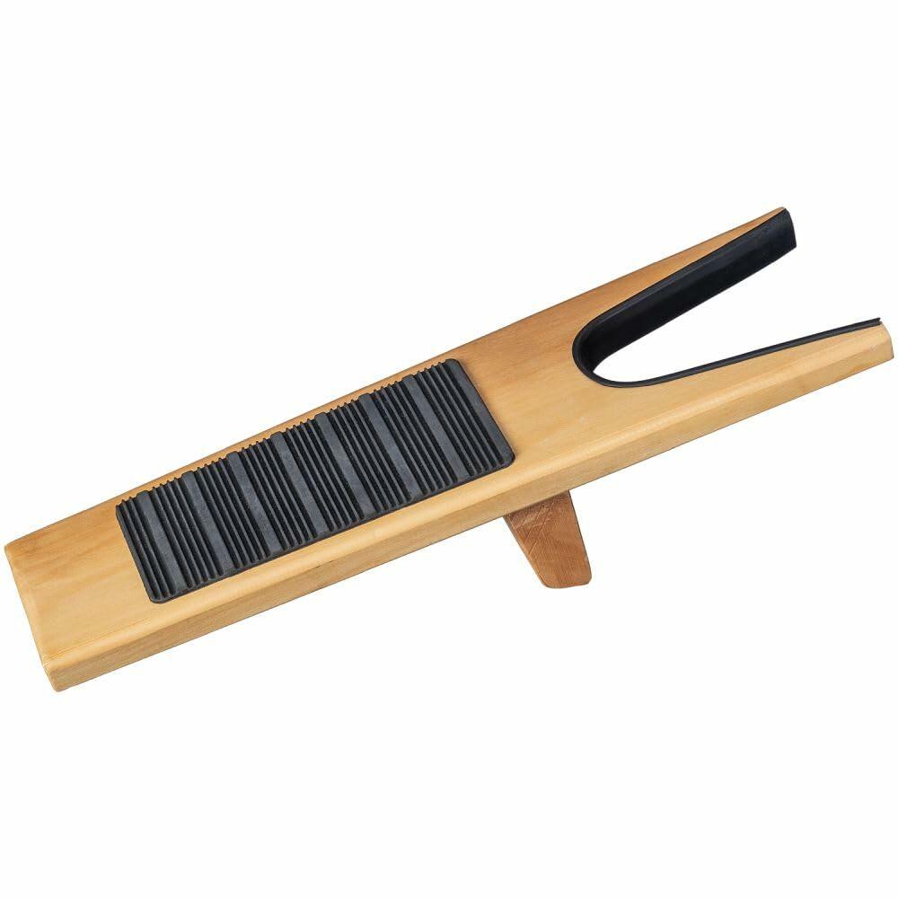 Wooden shoe tree with black rubber sole on a white background