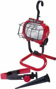 Red work light with stand and attachments on a white background