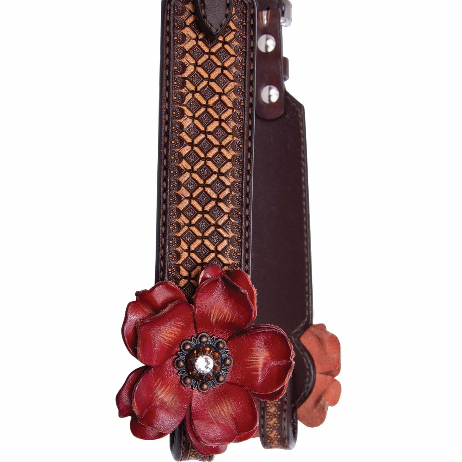 Brown leather strap with intricate patterns and a large red floral embellishment on a white background