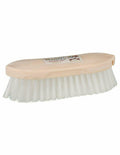 Oval brush with wooden handle and white bristles on a white background