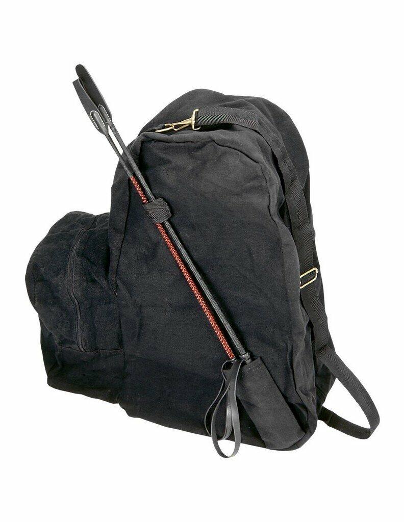 Black backpack with a long black strap on a white background