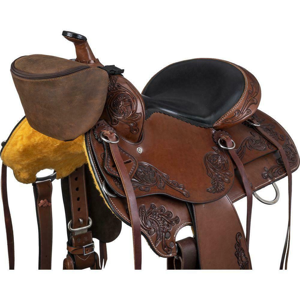 Brown leather saddle with intricate designs on a white background