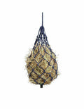 Hay ball in a net bag on a white background