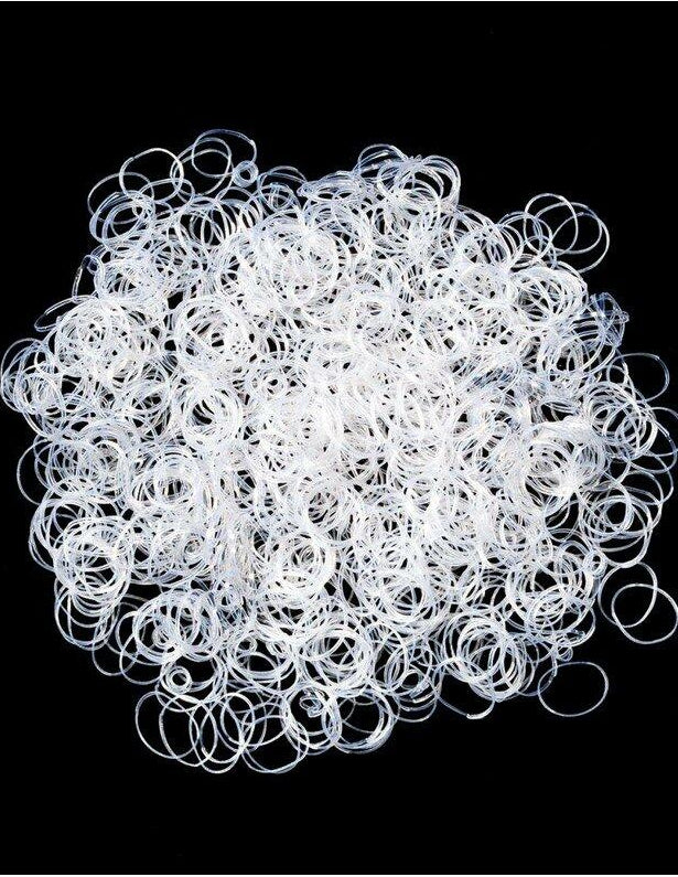 White rubber bands on a black background