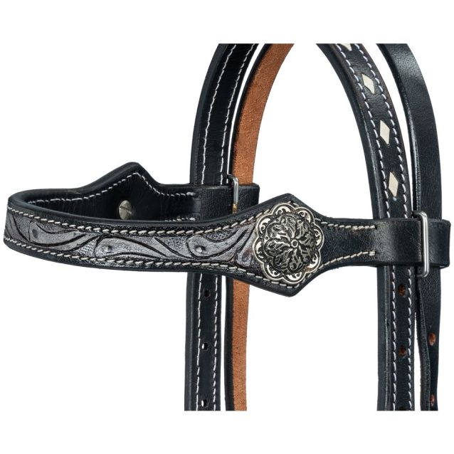 Close-up view of the black leather miniature horse headstall's browband, highlighting detailed hand-tooled leather patterns, neat white buckstitching, and a large, ornate antiqued silver concho.