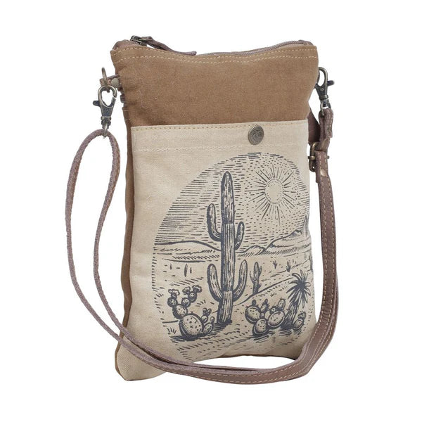Canvas crossbody bag with desert scene design on a white background